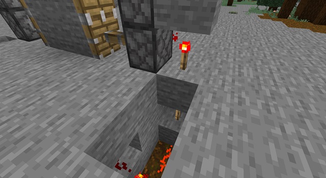 Colocação de tochas de Redstone na porta do Minecraft Redstone